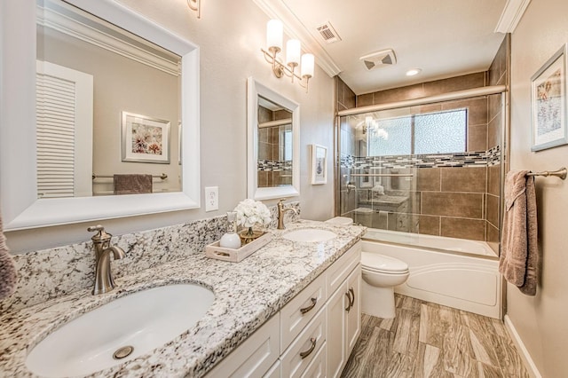 6619 N Valentine Ave, Fresno, CA 93711 - full bathroom with double vanity, enclosed tub / shower combo, and ornamental molding