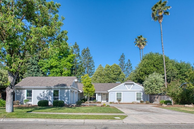 6619 N Valentine Ave, Fresno, CA 93711 - ranch-style home featuring concrete driveway and a front lawn