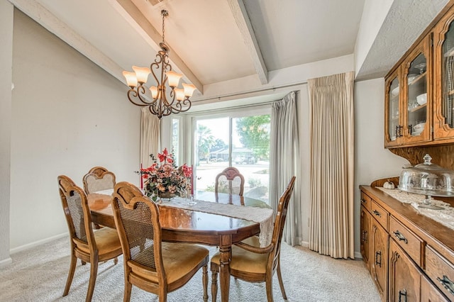 dining space featuring light carpet, a chandelier, and baseboards