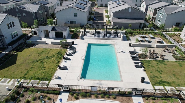 aerial perspective of suburban area with a pool