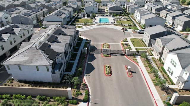 aerial perspective of suburban area featuring a pool