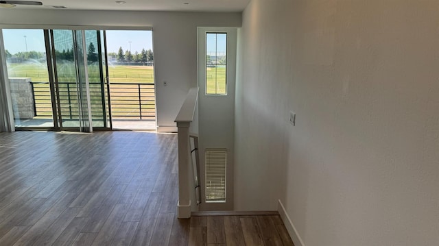 entryway featuring wood finished floors and baseboards