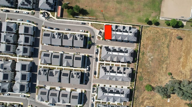 aerial view of property and surrounding area with property boundaries highlighted and nearby suburban area