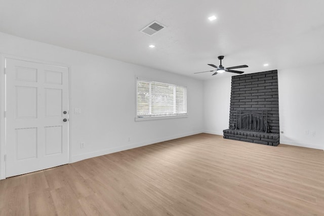 424 W Menlo Ave, Clovis, CA 93612 - unfurnished living room featuring a ceiling fan, light wood-style flooring, recessed lighting, a fireplace, and baseboards