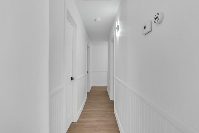 424 W Menlo Ave, Clovis, CA 93612 - hallway with light wood-style flooring and a decorative wall