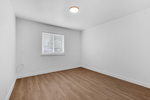 424 W Menlo Ave, Clovis, CA 93612 - empty room with wood finished floors and baseboards