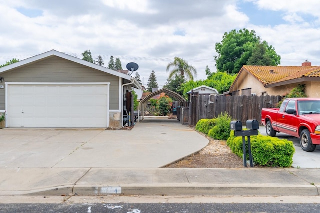 424 W Menlo Ave, Clovis, CA 93612 - view of property exterior featuring fence, a detached garage, and a gate