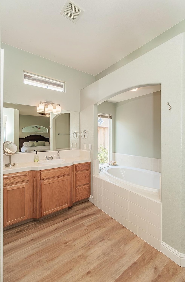 287 W Trenton Ave, Clovis, CA 93619 - full bathroom with a bath, vanity, and wood finished floors