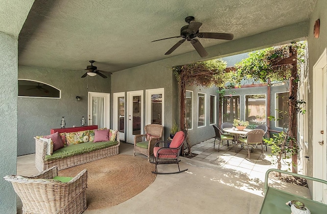 view of patio / terrace with a ceiling fan, french doors, outdoor lounge area, and outdoor dining space