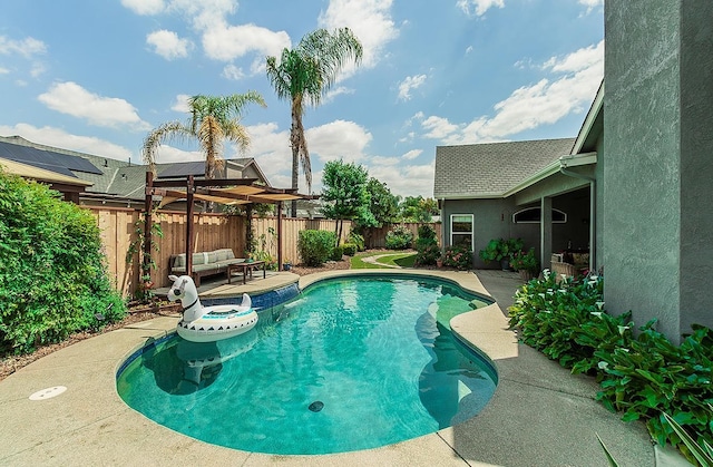 view of pool with a fenced backyard, a patio, and an outdoor living space