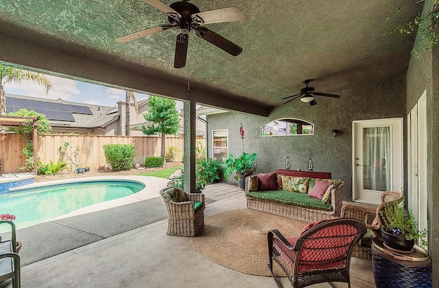 view of patio / terrace with a ceiling fan and a fenced backyard
