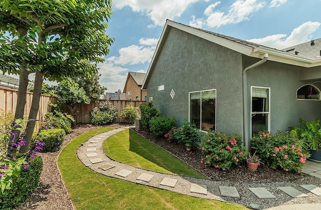 287 W Trenton Ave, Clovis, CA 93619 - view of side of home featuring stucco siding and central AC