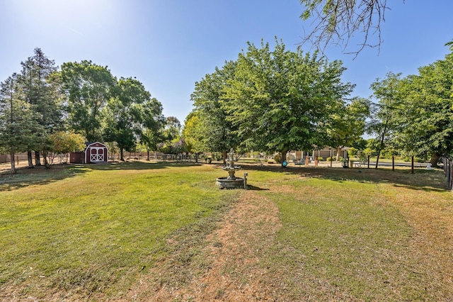 13801 E Rialto Ave, Sanger, CA 93657 - view of yard with a storage unit and an outdoor structure