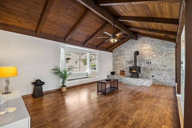 13801 E Rialto Ave, Sanger, CA 93657 - living room with wooden ceiling, ceiling fan, a wood stove, wood finished floors, and brick wall