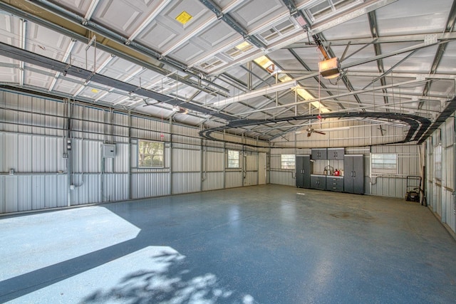13801 E Rialto Ave, Sanger, CA 93657 - garage with a garage door opener and metal wall