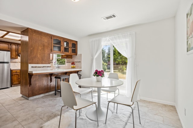 13801 E Rialto Ave, Sanger, CA 93657 - dining room featuring baseboards