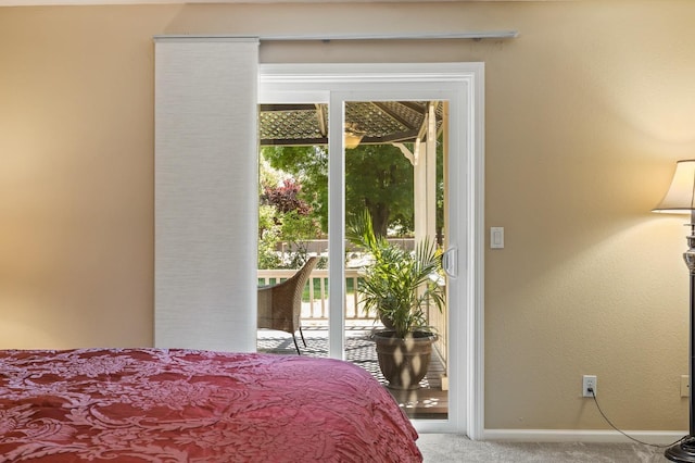 13801 E Rialto Ave, Sanger, CA 93657 - bedroom with carpet flooring, multiple windows, access to exterior, and baseboards