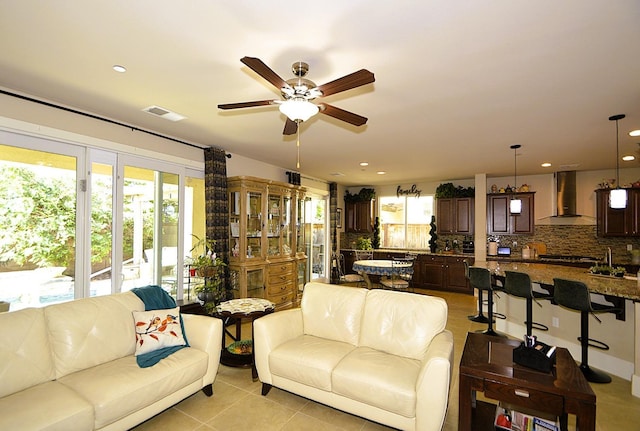 3476 Trenton Ln, Clovis, CA 93619 - living area with healthy amount of natural light, ceiling fan, light tile patterned floors, and recessed lighting