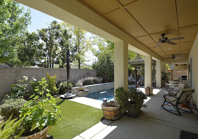 view of patio / terrace with a ceiling fan and a fenced backyard
