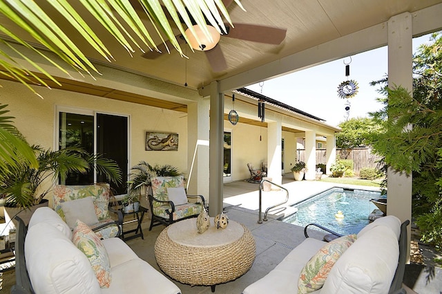 outdoor pool with an outdoor hangout area, ceiling fan, a patio, and fence