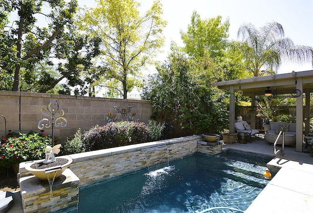 view of swimming pool featuring a ceiling fan, a fenced backyard, and a patio area