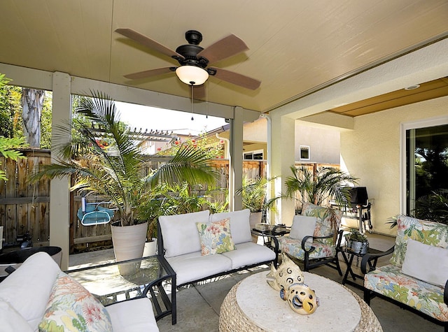 view of patio / terrace featuring a fenced backyard, ceiling fan, and outdoor lounge area