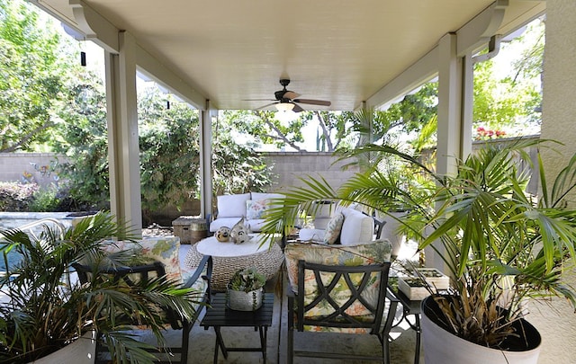 view of patio / terrace with a ceiling fan and fence