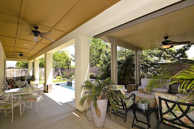 view of patio / terrace with ceiling fan, a fenced backyard, outdoor dining area, and an outdoor hangout area