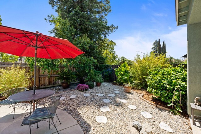 view of patio / terrace featuring fence