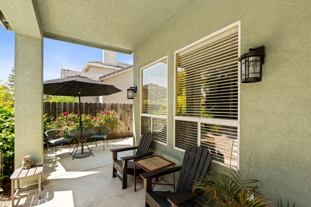 view of patio featuring fence
