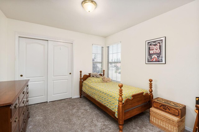 bedroom featuring a closet, carpet, and baseboards