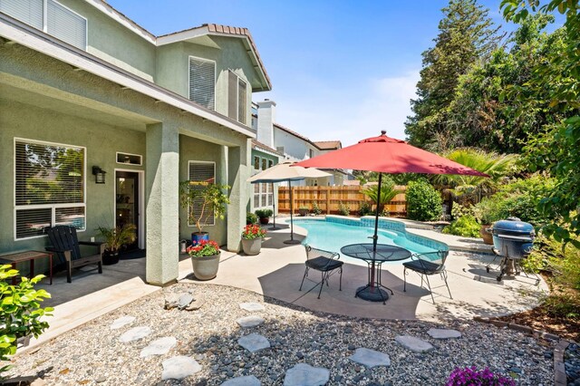 view of patio / terrace featuring fence and grilling area