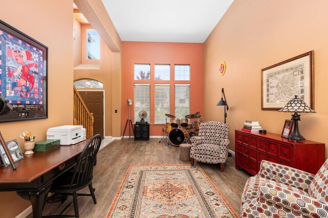 office space with wood finished floors and baseboards