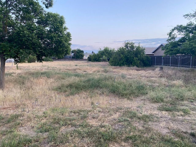 view of yard with fence and a view of countryside