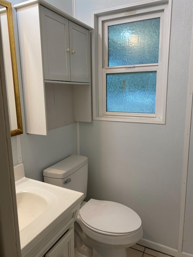 half bathroom with toilet and vanity