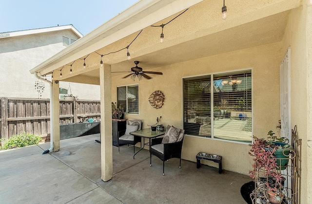 6588 E Lowe Ave, Fresno, CA 93727 - view of patio with fence and a ceiling fan
