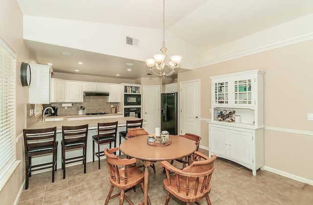 6588 E Lowe Ave, Fresno, CA 93727 - dining space featuring a chandelier, light tile patterned floors, recessed lighting, and high vaulted ceiling