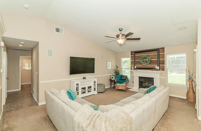6588 E Lowe Ave, Fresno, CA 93727 - carpeted living room with a ceiling fan, vaulted ceiling, baseboards, and a large fireplace