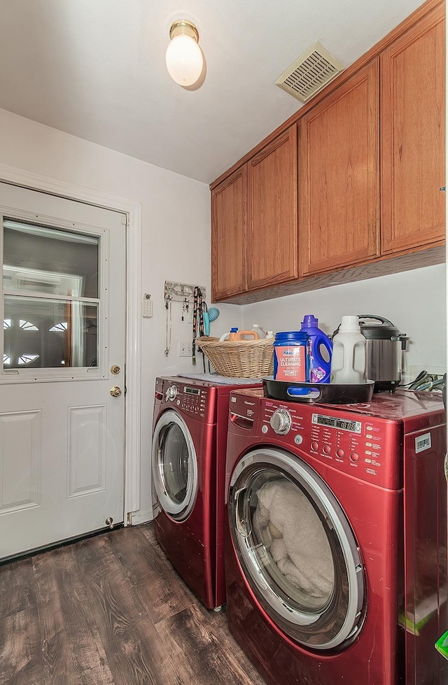 3042 Love St, Selma, CA 93662 - laundry area featuring cabinet space, dark wood-style floors, and washing machine and clothes dryer