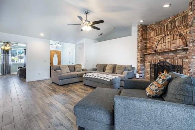 2371 Sophia Ln, Kingsburg, CA 93631 - living room featuring a ceiling fan, lofted ceiling, a fireplace, wood finished floors, and baseboards