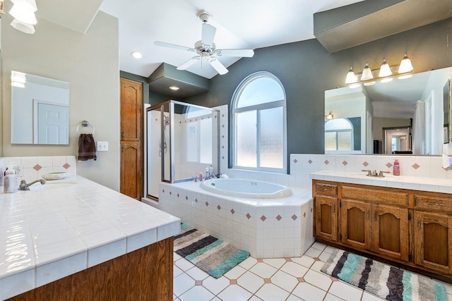 2371 Sophia Ln, Kingsburg, CA 93631 - bathroom with a stall shower, a garden tub, ceiling fan, vanity, and backsplash