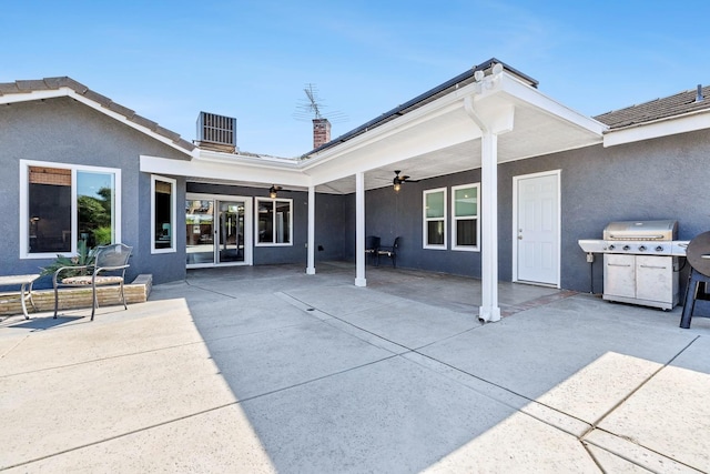 2371 Sophia Ln, Kingsburg, CA 93631 - back of property with ceiling fan, a patio, a chimney, stucco siding, and central air condition unit