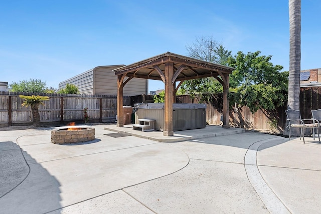 2371 Sophia Ln, Kingsburg, CA 93631 - view of patio / terrace with an outdoor fire pit, a hot tub, a gazebo, and a fenced backyard