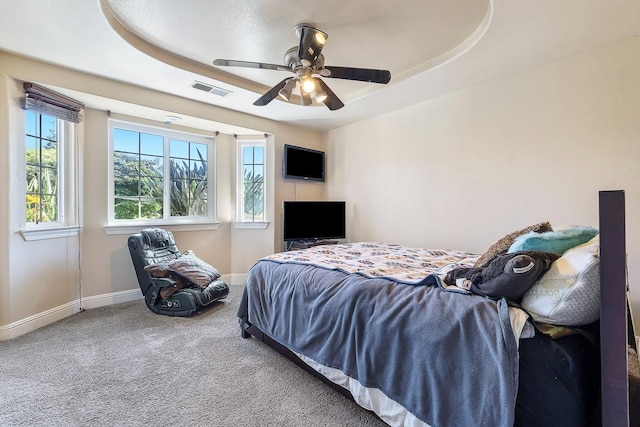 2371 Sophia Ln, Kingsburg, CA 93631 - carpeted bedroom featuring baseboards, ceiling fan, and a tray ceiling