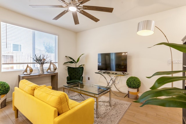 6458 E Riesling Dr, Fresno, CA 93727 - living area with wood finished floors and ceiling fan