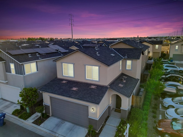6458 E Riesling Dr, Fresno, CA 93727 - traditional-style home with stucco siding, an attached garage, driveway, a shingled roof, and a residential view
