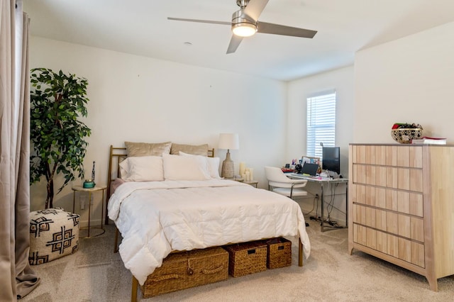 6458 E Riesling Dr, Fresno, CA 93727 - bedroom featuring light carpet, a desk, and a ceiling fan