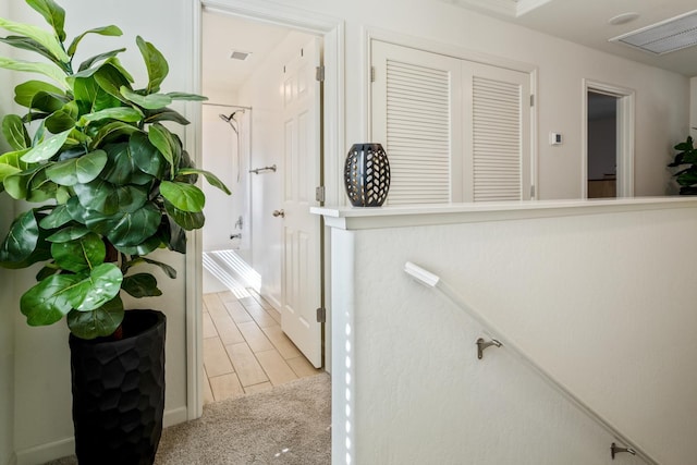 6458 E Riesling Dr, Fresno, CA 93727 - hallway featuring light colored carpet