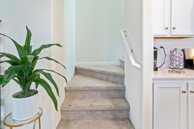 6458 E Riesling Dr, Fresno, CA 93727 - stairs with baseboards and carpet floors