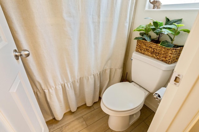 6458 E Riesling Dr, Fresno, CA 93727 - full bathroom featuring wood finished floors and toilet